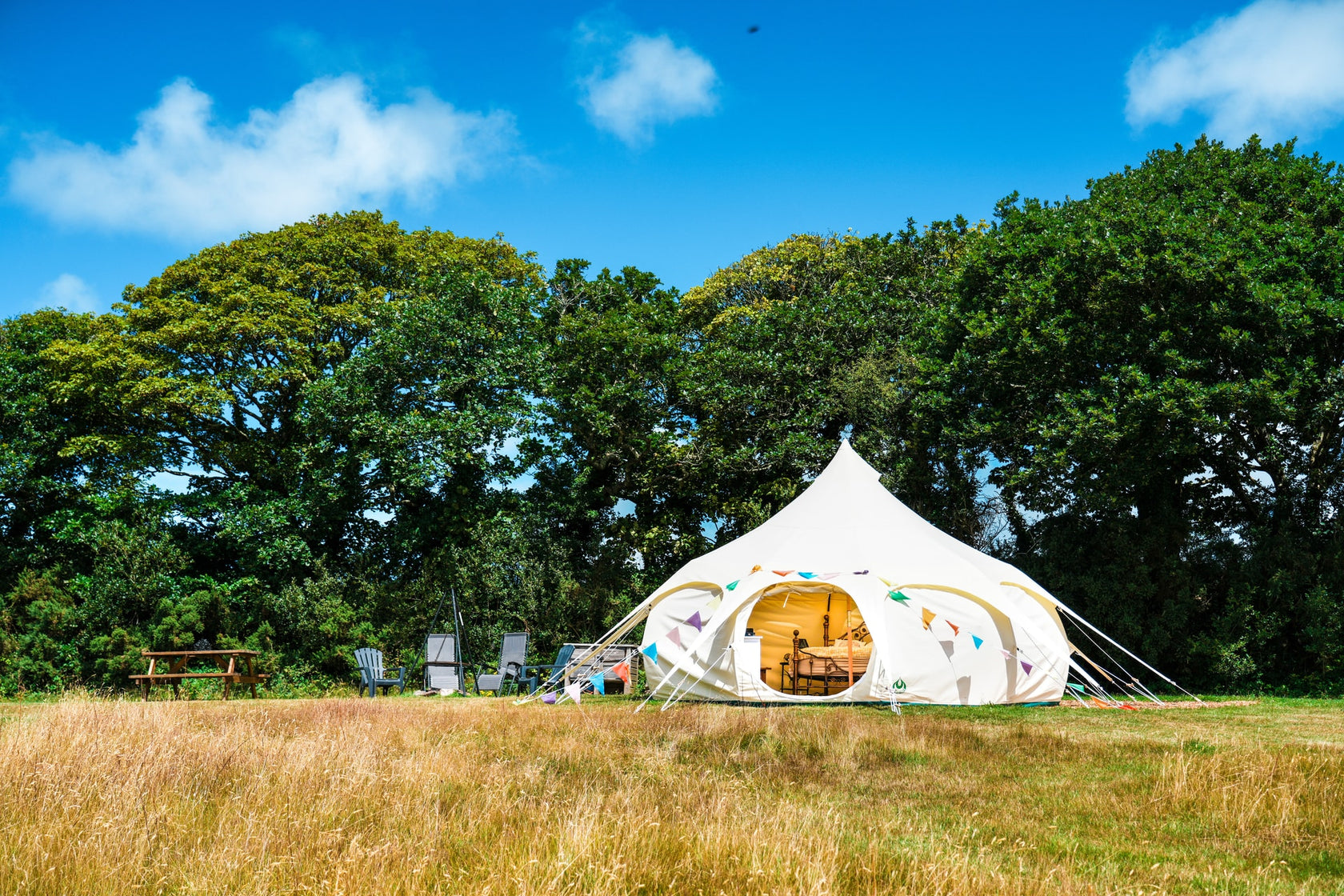 Lotus Belle Luxury Bell Tent set up in a meadow in Cornwall